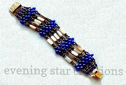  5-Strand Bracelet of Cobalt Blue Czech Glass Beads, Cream Mother-of-Pearl Beads, Antique Gold Findings and a Gold-Plated Clip-in Clasp. For more details, close this window and click on 